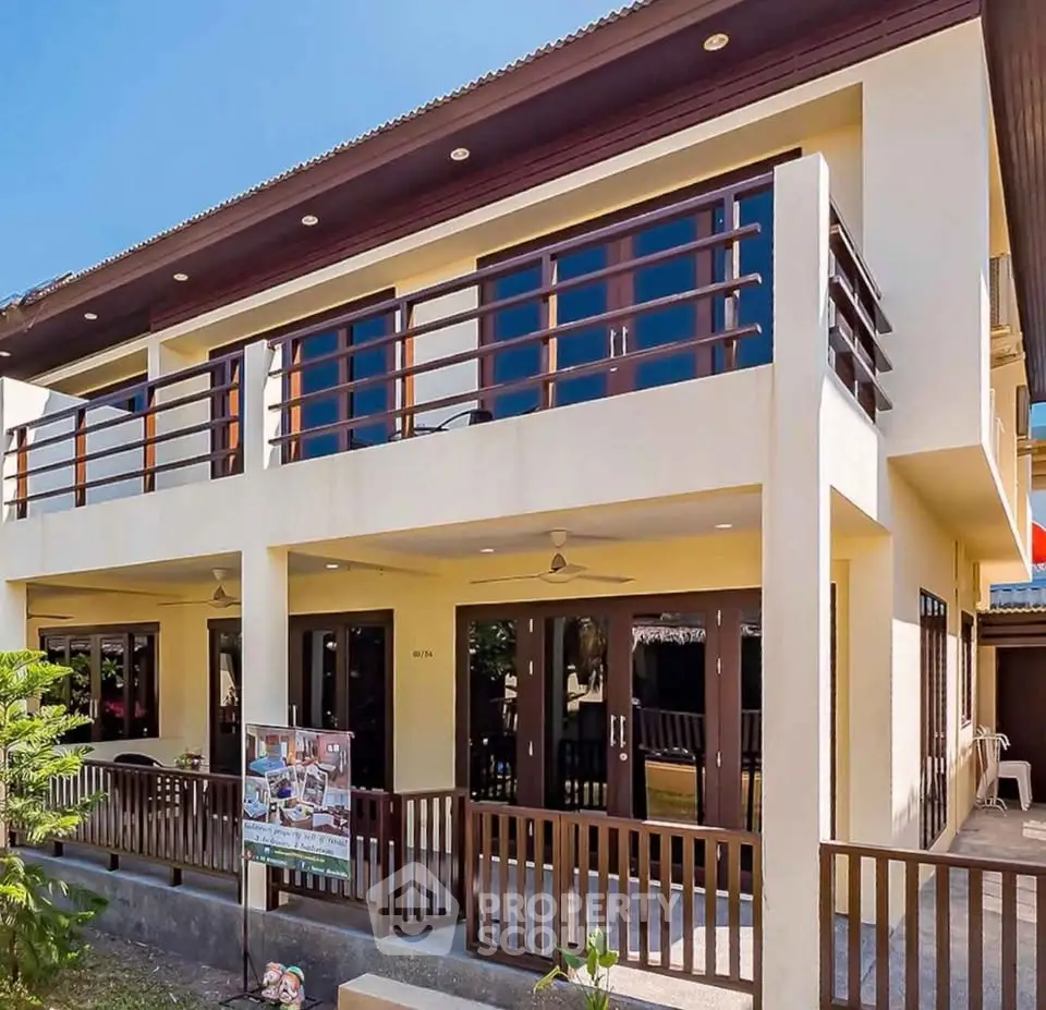 Stunning two-story home with spacious balcony and modern design.