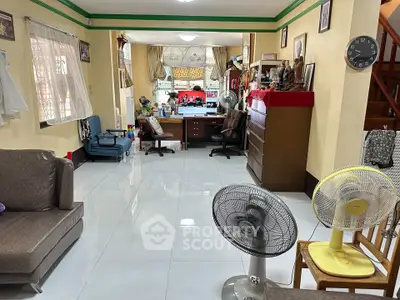 Spacious living room with tiled floors and cozy seating area