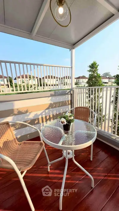 Charming balcony with cozy seating and scenic view, perfect for relaxation and outdoor enjoyment.