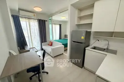 Modern studio apartment with open kitchen and cozy living area