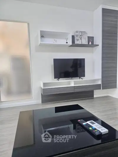 Modern living room with sleek TV unit and stylish decor