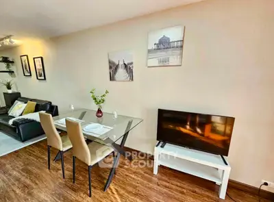 Stylish living room with modern dining area and cozy seating, perfect for entertaining guests.