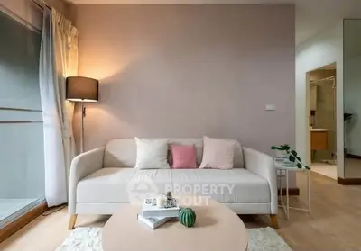 Cozy living room with modern sofa and soft lighting, perfect for relaxation.