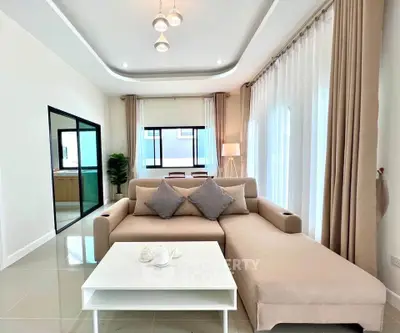 Spacious modern living room with elegant decor and natural light