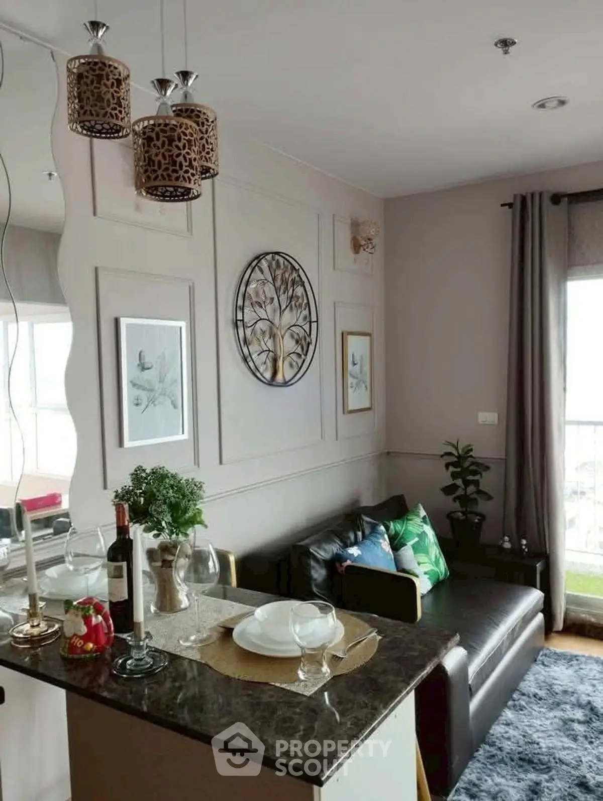Stylish living room with modern decor and natural light, featuring a cozy sofa and elegant dining setup.