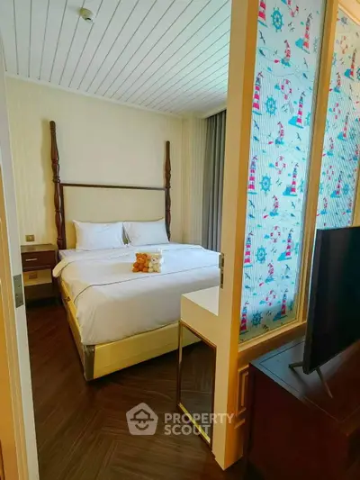 Cozy bedroom with elegant decor and plush bedding, perfect for relaxation and comfort.