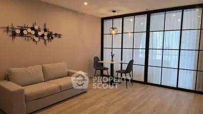 Modern living room with stylish decor and cozy seating area.