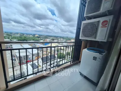 High-rise balcony with city view and washing machine, perfect for urban living.