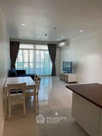 Spacious modern living room with sleek furniture and natural light