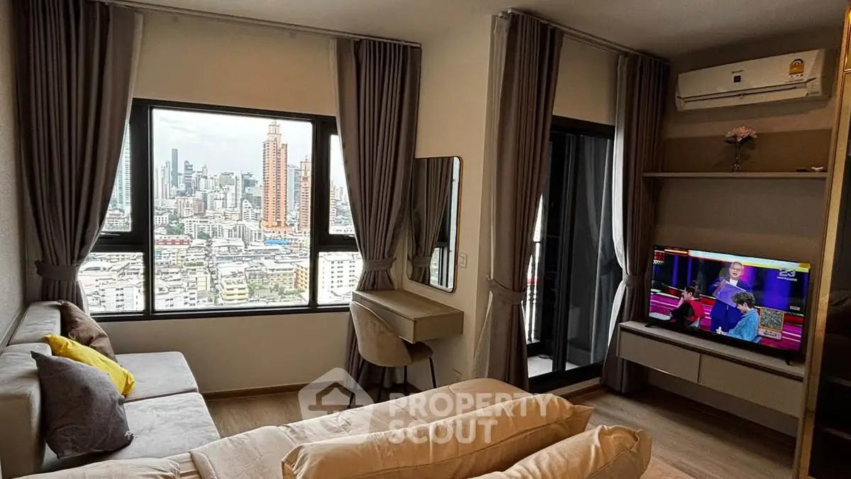 Modern living room with city view, stylish furniture, and wall-mounted TV in high-rise apartment.