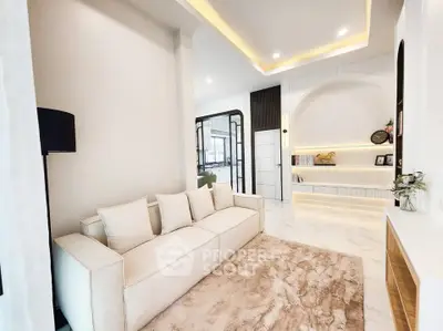 Luxurious modern living room with elegant decor and plush seating.