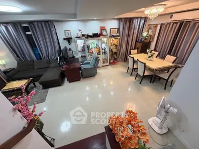 Spacious living and dining area with elegant decor and ample natural light.