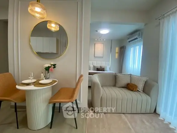 Chic modern living room with cozy seating and elegant dining area, perfect for urban living.