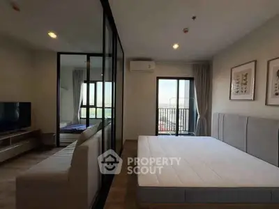 Modern bedroom with balcony view and stylish decor in urban apartment