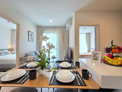 Modern open-plan living and dining area with elegant decor and natural light