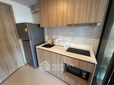 Modern kitchen with sleek wooden cabinets and built-in appliances