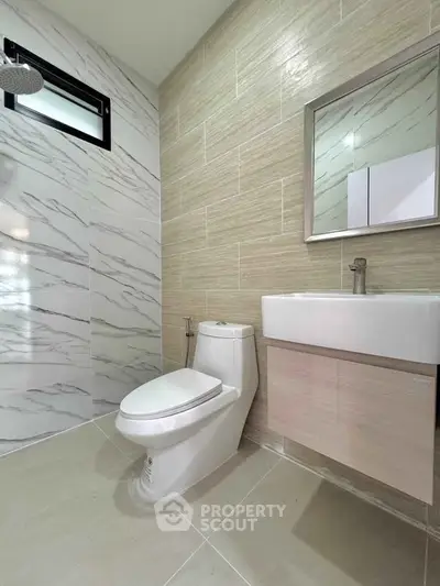 Modern bathroom with sleek fixtures and stylish tile design