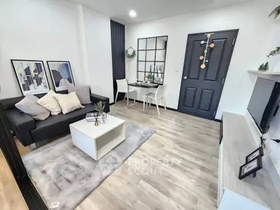 Modern living room with stylish decor, cozy seating, and elegant dining area, perfect for urban living.