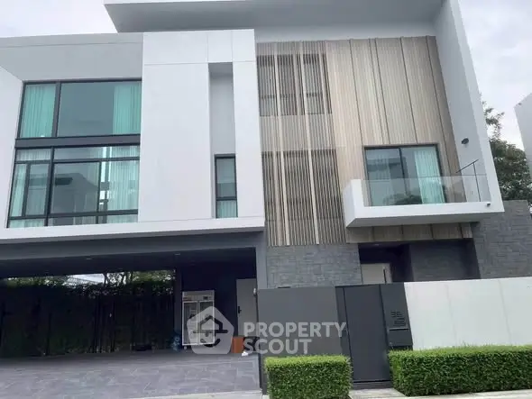 Modern luxury house exterior with sleek design and large windows in a serene neighborhood.