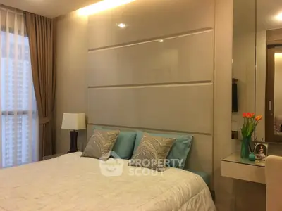 Luxurious bedroom with elegant decor and large window view