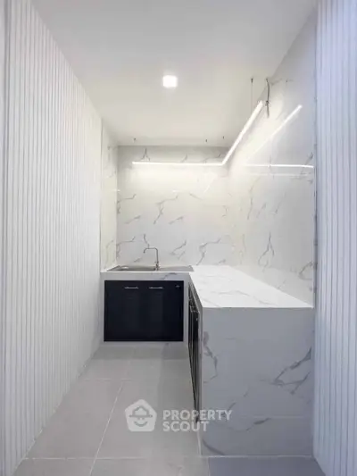 Sleek modern kitchen with marble countertops and minimalist design