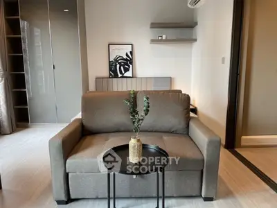 Modern living room with stylish sofa and minimalist decor in a cozy apartment.