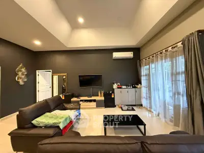 Spacious modern living room with high ceiling and elegant decor