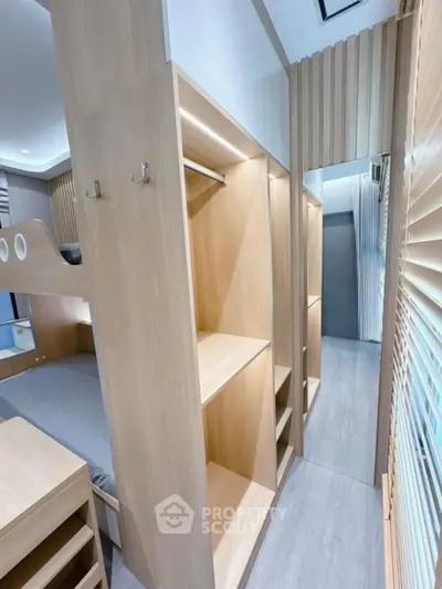 Modern bedroom with wooden storage and bunk bed design