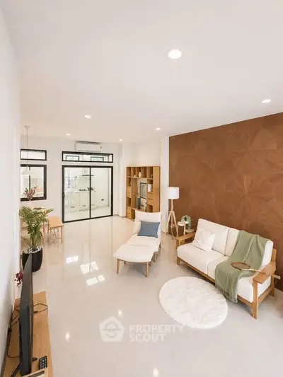 Spacious modern living room with elegant decor and open layout, perfect for relaxation and entertainment.