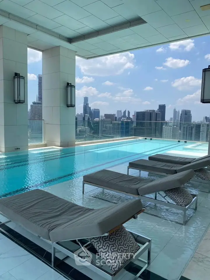 Luxurious rooftop pool with stunning city skyline views and modern lounge chairs.
