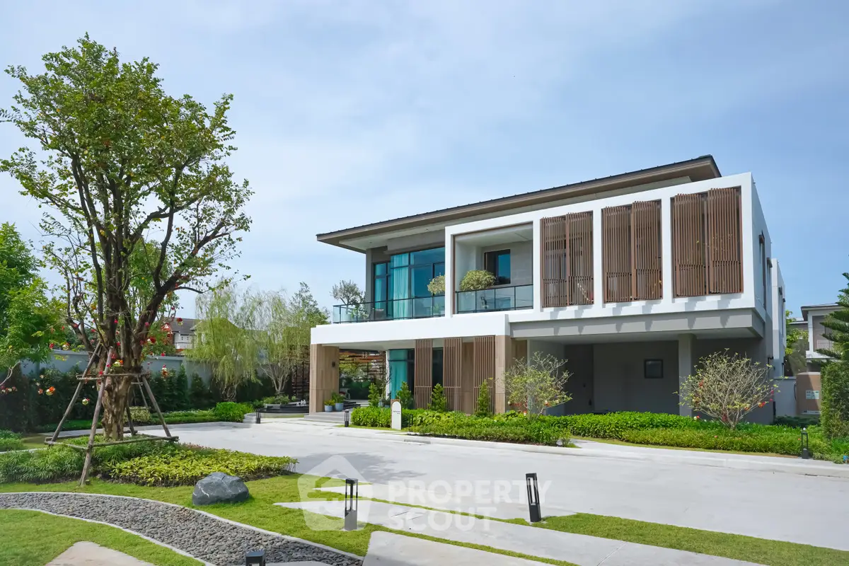 Modern luxury house with sleek design and lush landscaping