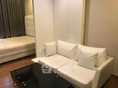 Modern living room with white sofa and elegant decor in cozy apartment