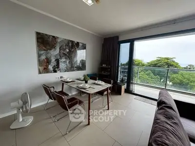 Modern living room with dining area and stunning balcony view