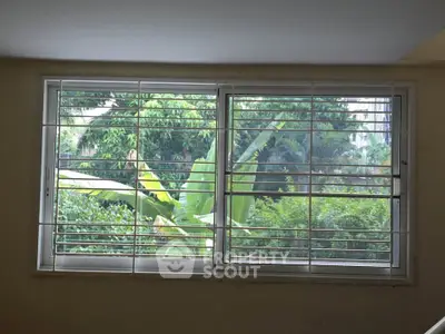 Bright window with lush green garden view enhancing natural light