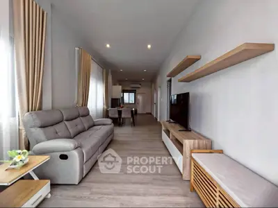 Spacious modern living room with sleek furniture and natural light