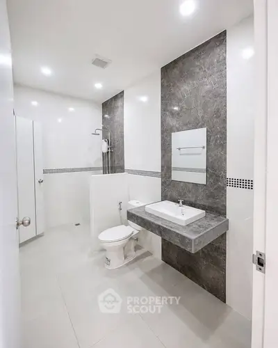 Modern bathroom with sleek design and elegant fixtures in a contemporary home.