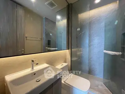 Modern bathroom with sleek design and glass shower enclosure