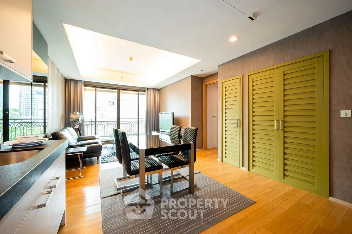 Modern living room with stylish furniture and large windows offering city views