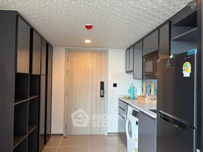 Modern kitchen with sleek appliances and ample storage space