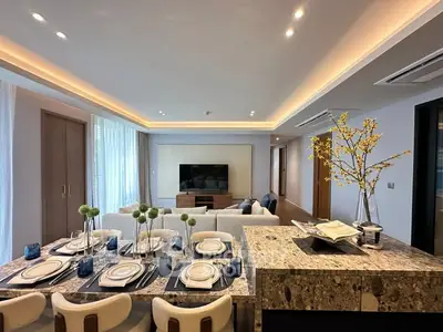 Luxurious open-plan living room with elegant dining area and modern decor