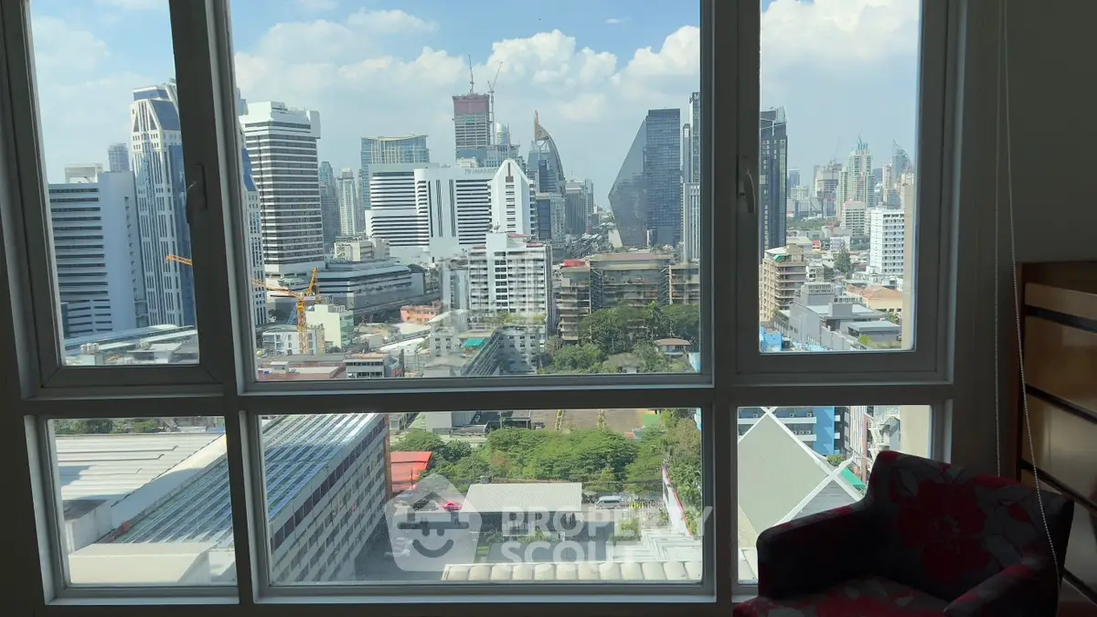 Stunning cityscape view from a high-rise apartment window, showcasing modern urban skyline.