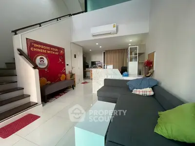 Spacious living room with modern decor and comfortable seating, ideal for relaxation and entertainment.