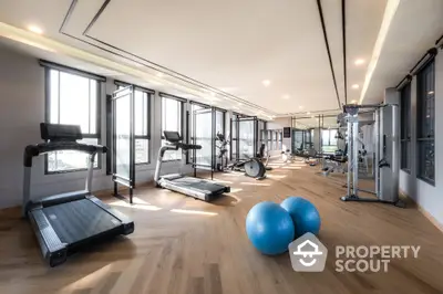 Spacious modern gym with state-of-the-art equipment and natural light