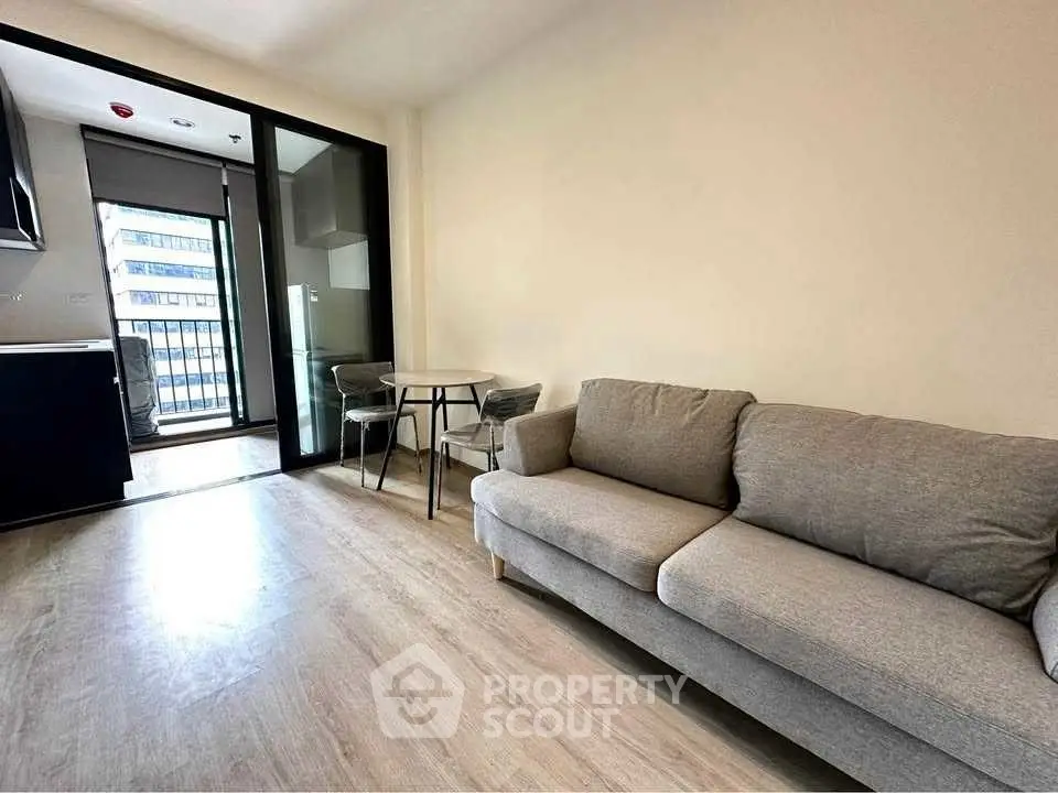 Modern living room with balcony view in urban apartment