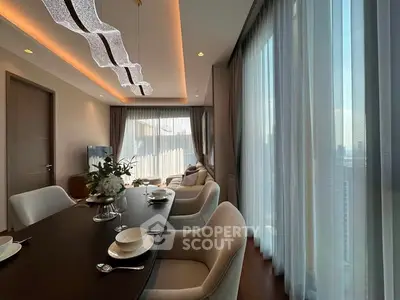 Luxurious dining area with elegant lighting and panoramic city views