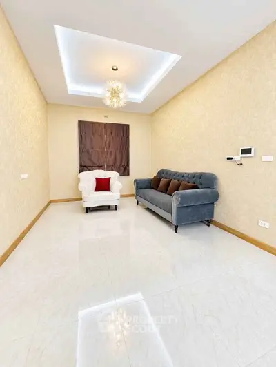 Elegant living room with plush seating and modern lighting in a stylish home.
