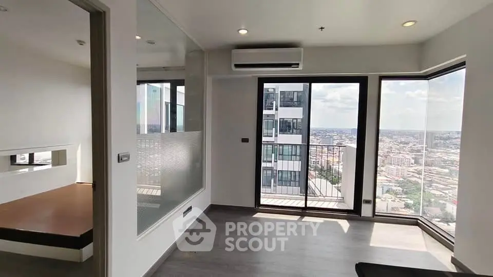 Modern high-rise apartment with stunning city view and large windows