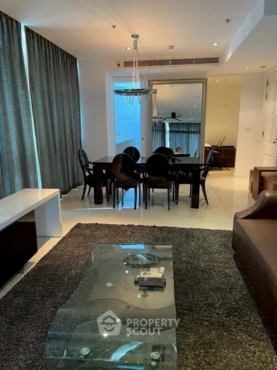 Elegant living room with modern dining area and stylish decor