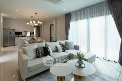 Luxurious modern living room with elegant decor and open kitchen layout