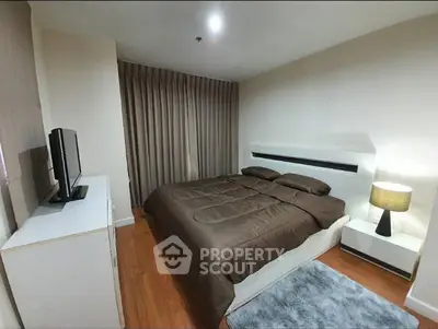 Cozy modern bedroom with stylish decor and ambient lighting, perfect for relaxation and comfort.